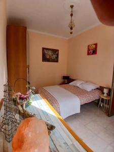 a bedroom with a bed and a glass table at Casa La V G in Almese