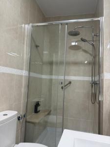 a bathroom with a shower with a toilet and a sink at LUZ DEL MAR Almuñécar Centro Playa in Almuñécar