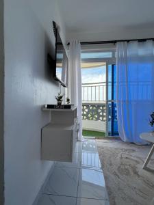 a living room with a view of the ocean at Skyview Bamburi Suites in Mombasa