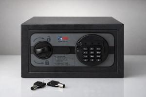 a microwave oven with two remote controls on a table at Haroupia The Residence in Kalidhón