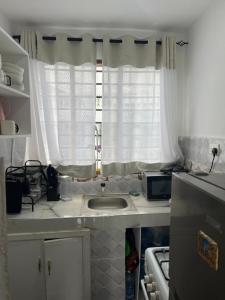 a kitchen with a sink and a window at Azure Coast retreat in Watamu