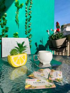 a table with a cup of coffee and a lemon on it at Lemon Luxury Studio in Xanthi