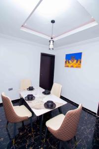 a meeting room with a table and chairs at Living Space Apartment in Ibadan