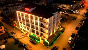 an overhead view of a building in a city at night at Koc Hotel in Karasu