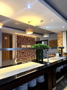 a kitchen with a counter with plates on it at Koc Hotel in Karasu