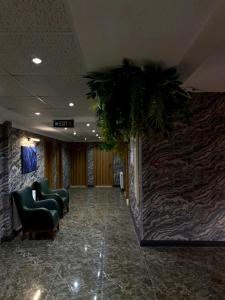 a waiting room with chairs and a plant at Koc Hotel in Karasu +80 photos
