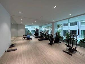 a gym with treadmills and exercise equipment in a building at Condo D-Eco Wellness Center A8721 in North Pattaya