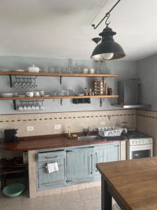a kitchen with a sink and a counter top at Casa taller in Tigre