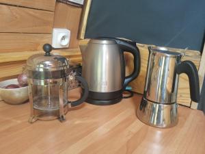a coffee pot and a blender on a table at La Verdine in Lacaze