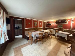 a dining room with a table and chairs at Nenchova Guest House in Koprivshtitsa