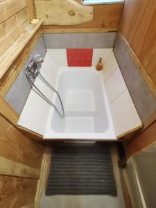 an overhead view of a sink in a tiny house at La Verdine in Lacaze +28 photos