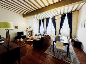 a living room with a couch and a table at Descazeaux in Bordeaux