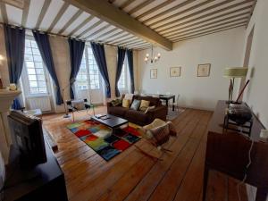 a living room with a couch and a table at Descazeaux in Bordeaux