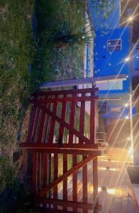 a wooden fence with a train in the background at Cande in Parana