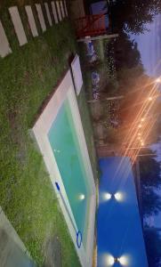 an overhead view of a swimming pool in the grass at Cande in Parana