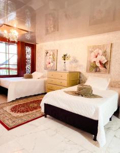 a bedroom with two beds and a dresser at Salamina Highs in Salamina +142 photos