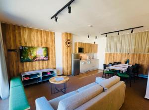 a living room with a couch and a table at Apartmány Stagnum Liptovský Ján in Liptovský Ján