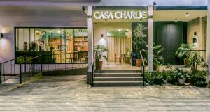 a store front of a building with plants in it at Casa Charlie Hotel in Manila