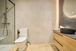 a bathroom with a toilet and a sink and a shower at Rosario 32 by keyhom in Salamanca +35 photos