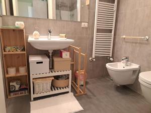 a bathroom with a sink and a toilet at Il TRE del TRENTA in Turin