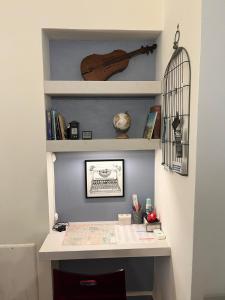 a desk in a room with a book shelf at Il TRE del TRENTA in Turin