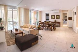 a living room with a couch and a table at Palm Beach 206 BL 4 by Holiday Stays in Aquiraz