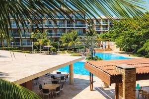 a resort with a swimming pool and a building at Palm Beach 206 BL 4 by Holiday Stays in Aquiraz