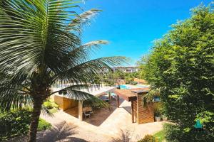 an aerial view of a house with a palm tree at Palm Beach 206 BL 4 by Holiday Stays in Aquiraz