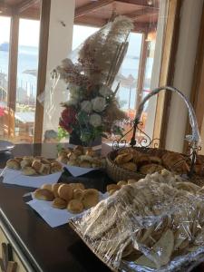 a table with plates of bread and a basket of bread at sharks bay oasis aqua park in Sharm El Sheikh