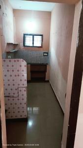 an empty room with a sink and a window at Durga Nivas in Kurnool