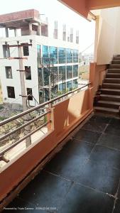 an empty building with stairs in front of a building at Durga Nivas in Kurnool