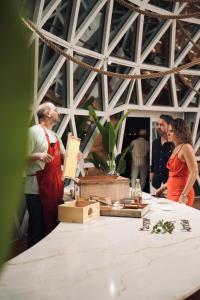 a group of people standing around a table at Luxeglamp in Umm Al Quwain