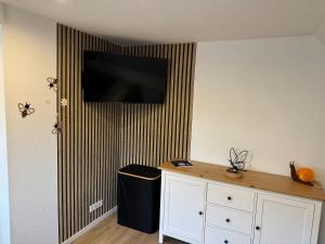 a flat screen tv hanging on a wall at Seequartier Borken in Borken