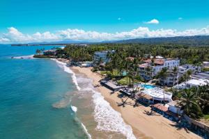 an aerial view of the beach in front of a resort at Panoramic Views Two Decks 1st Row Ocean Kite Beach in Cabarete