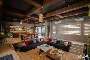 a living room with a couch and a table at Likha Wellness Resort in Lipa