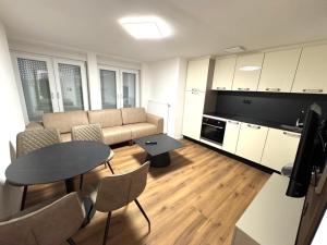 a living room with a couch and a table at Apartments Rosenstraße in Soltau