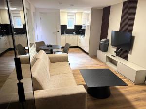 a living room with a couch and a table at Apartments Rosenstraße in Soltau