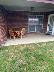 a table and chairs sitting on a patio at Kindness Dwells in Killeen