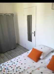 a bedroom with a bed with an open door at Porte de Paris in Saclay