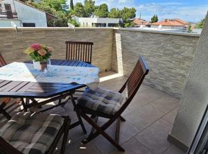 a table and chairs sitting on a patio at Villa Tena Rovinj Istria in Rovinj