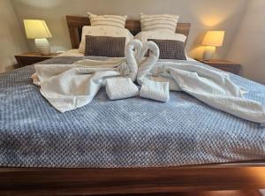 a bed with towels and pillows on it at Villa Tena Rovinj Istria in Rovinj