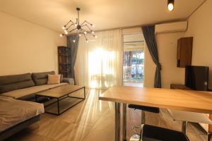 a living room with a couch and a table at SanPietro Apartments in Draç +227 photos