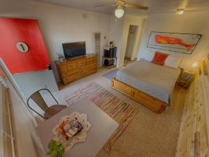an aerial view of a bedroom with a bed and a television at Salish Queen Mokee Shared Kitchen Pets OK! #1 in Bluff