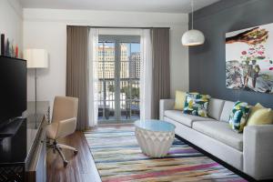 a living room with a couch and a table at Hotel Colonnade Coral Gables, Autograph Collection in Miami
