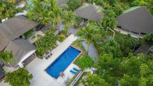 an overhead view of a resort with a swimming pool and palm trees at NO 7 Garden Villa in Rawai Beach +10 photos