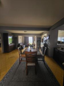 a living room with a wooden table and chairs at Mirador de San Miguel in San Miguel de Allende