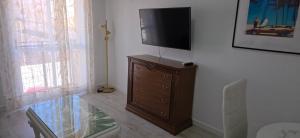 a room with a tv on top of a dresser at Apartamento Marandel in Ronda
