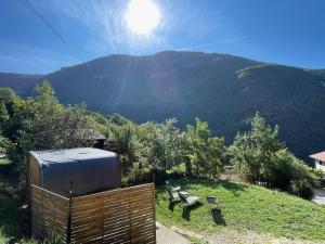 a view of a hill with a hot tub and a mountain at Retraites & Séminaires, Spa, La Ressource Malix 19 personnes in Tenay