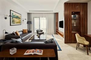 a living room with a couch and a table at Sheraton Nouakchott Hotel in Nouakchott