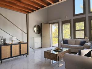 a living room with a couch and a table at Cassa Luca in Glarokavmos in Paliouri